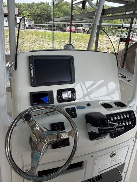 The image shows the helm of a 2018 NauticStar 28 boat with various instruments.