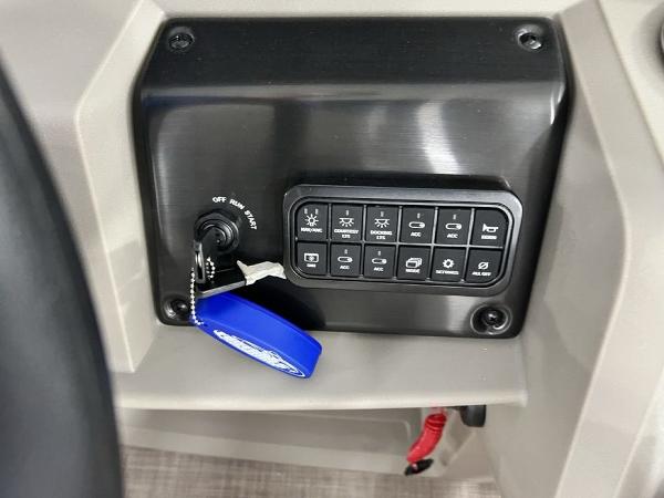 Control panel of 2025 Sun Tracker PARTY BARGE® 22 RF DLX with ignition and switches.