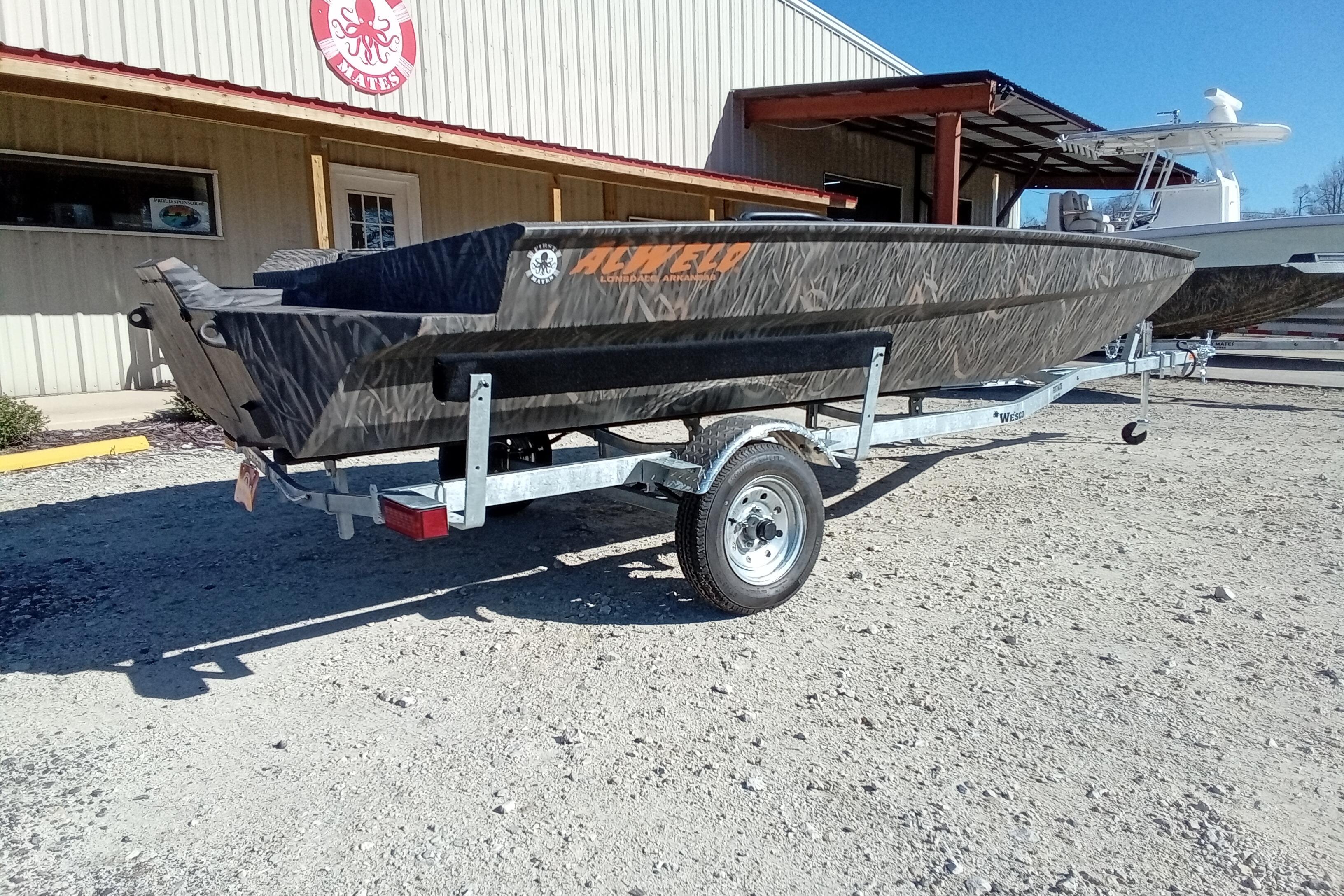 2026 Alweld 1756 Invader boat on trailer outside a building.