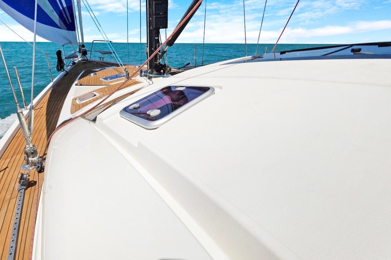 Sailing yacht Southerly 57 RS 2011 on open sea with clear skies.