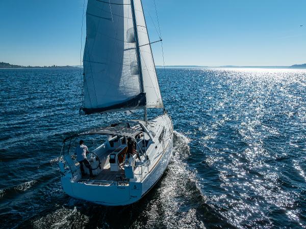 2021 Beneteau Oceanis 38.1 sailboat cruising on open water.