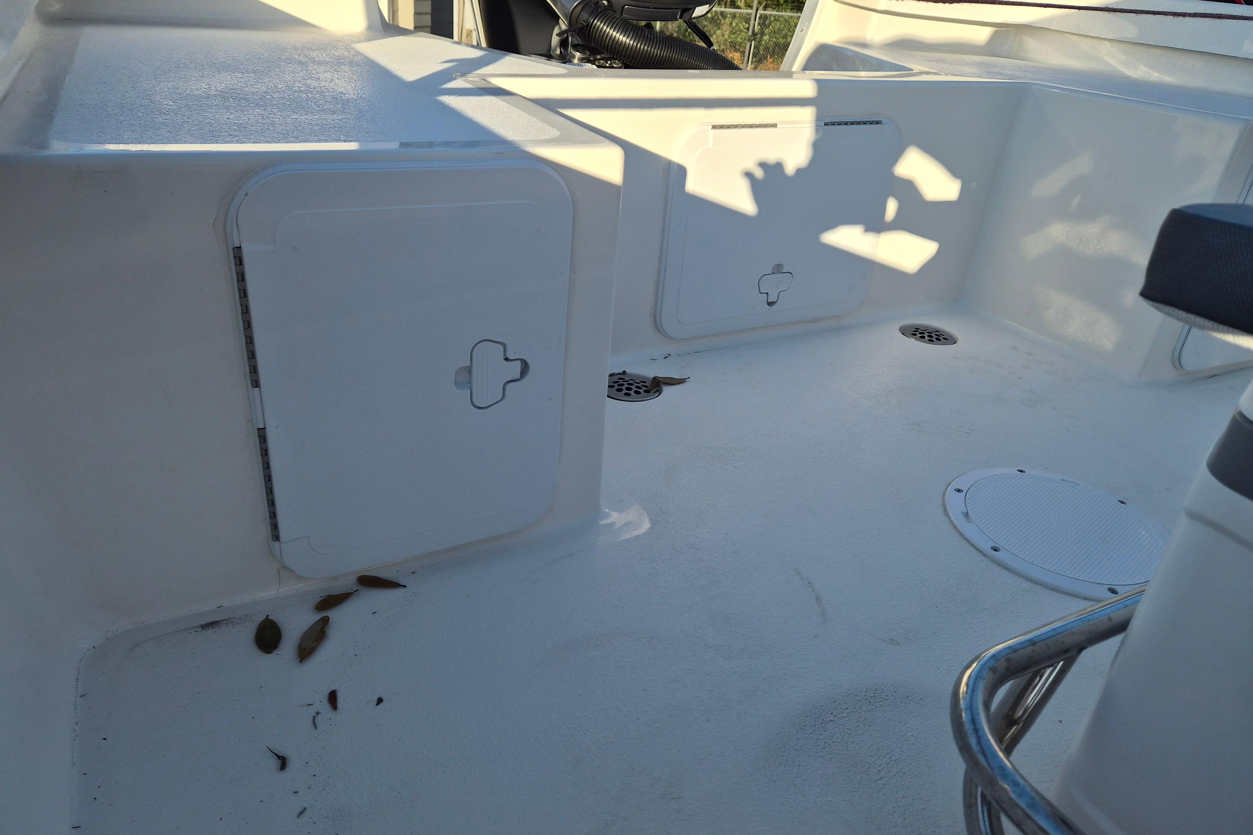 2026 May-Craft 192 boat interior with storage compartments and clean white deck.