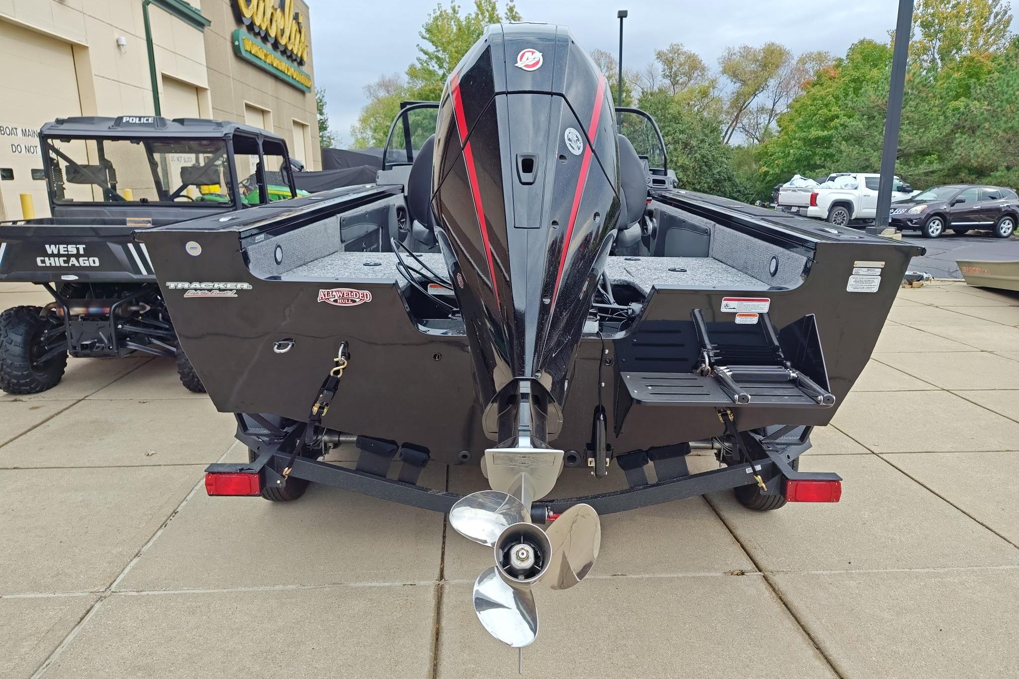 2026 Tracker Targa V-19 WT boat with powerful outboard motor, displayed outdoors.