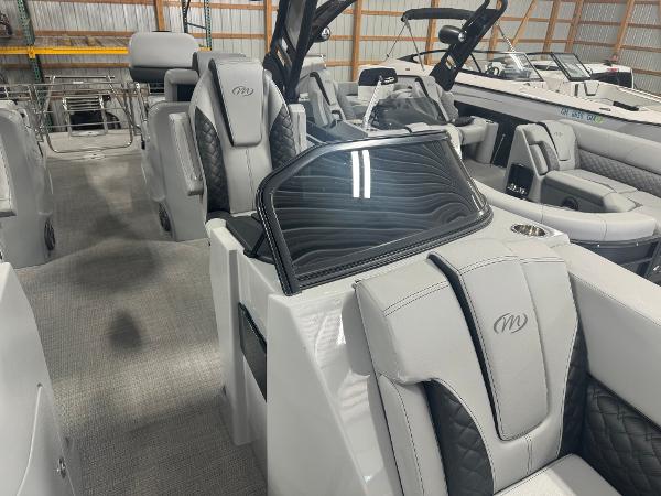 2025 Manitou LX boat interior with luxurious seating and modern design.