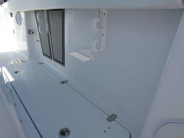 2024 Wellcraft 263 Fisherman boat interior storage compartments and speaker system.