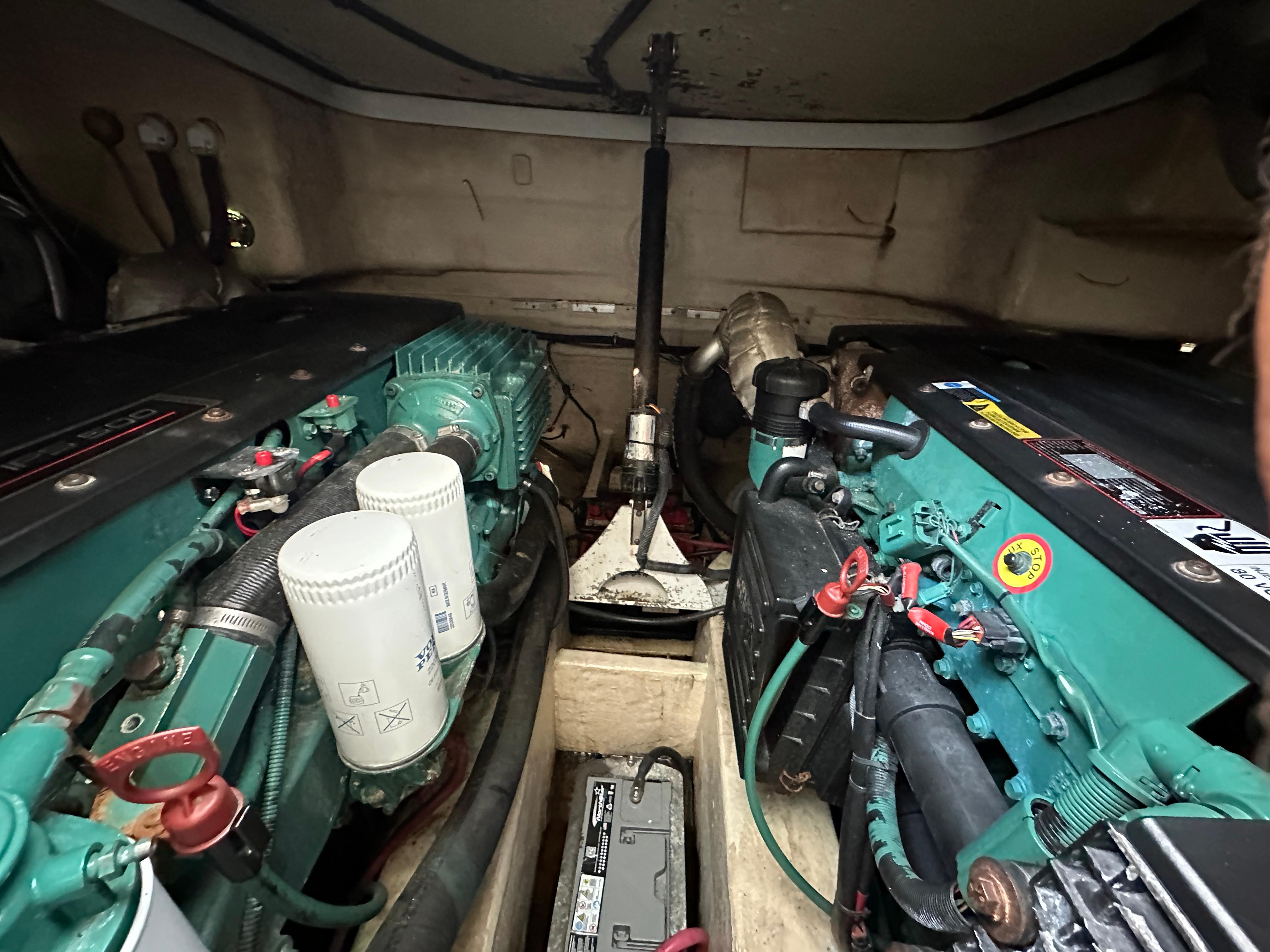 Engine room of a 2006 Formula 40pc boat, showcasing dual engines and components.