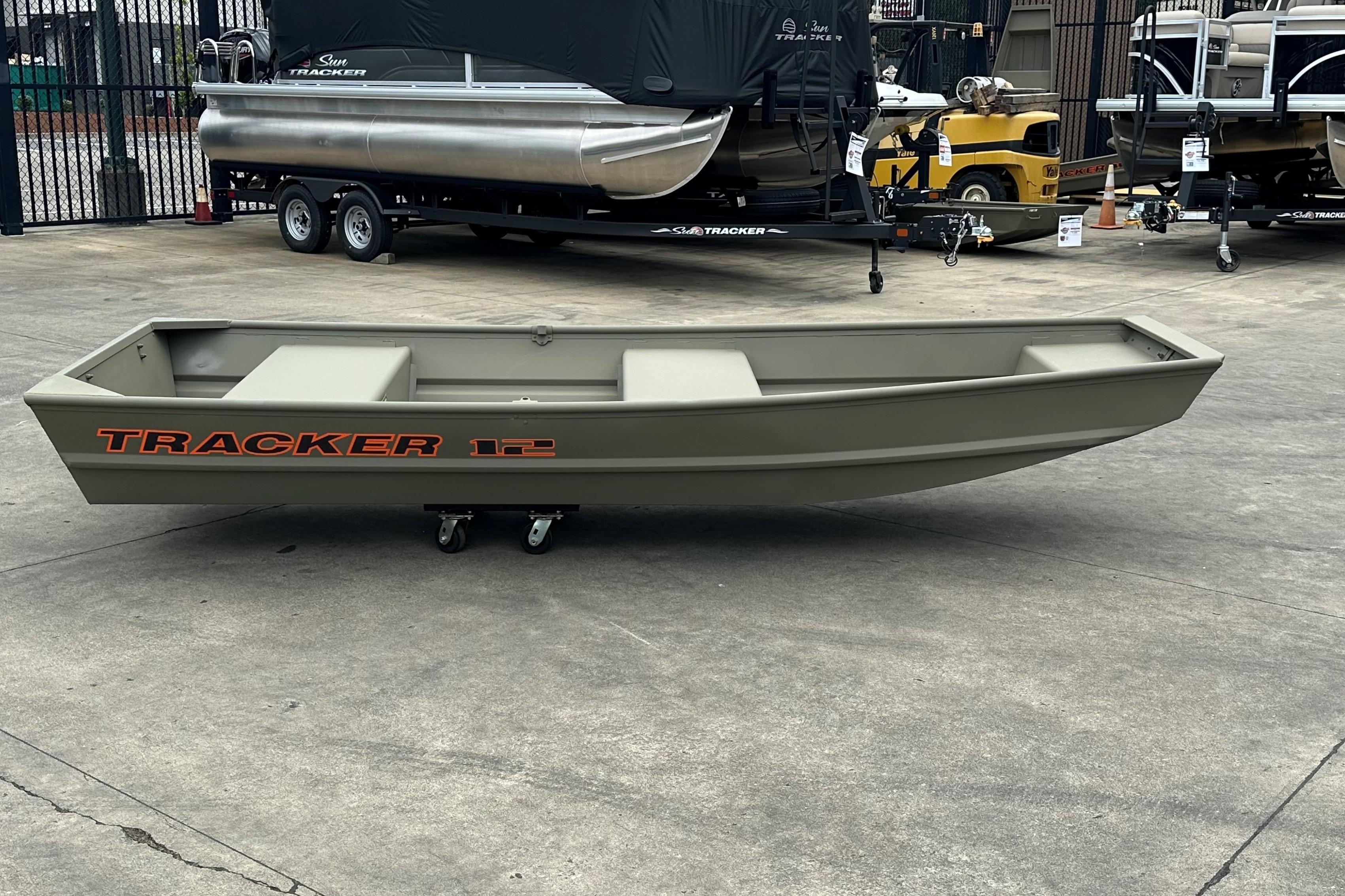 2026 Tracker Grizzly 12 Jon boat on display in a showroom setting.