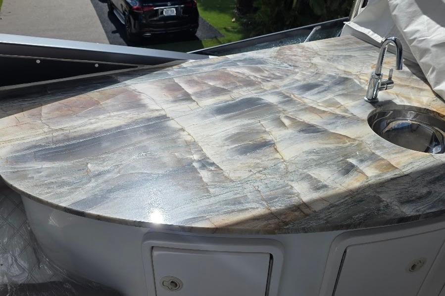 Luxurious marble countertop with sink on 2008 Neptunus Flybridge MY yacht.