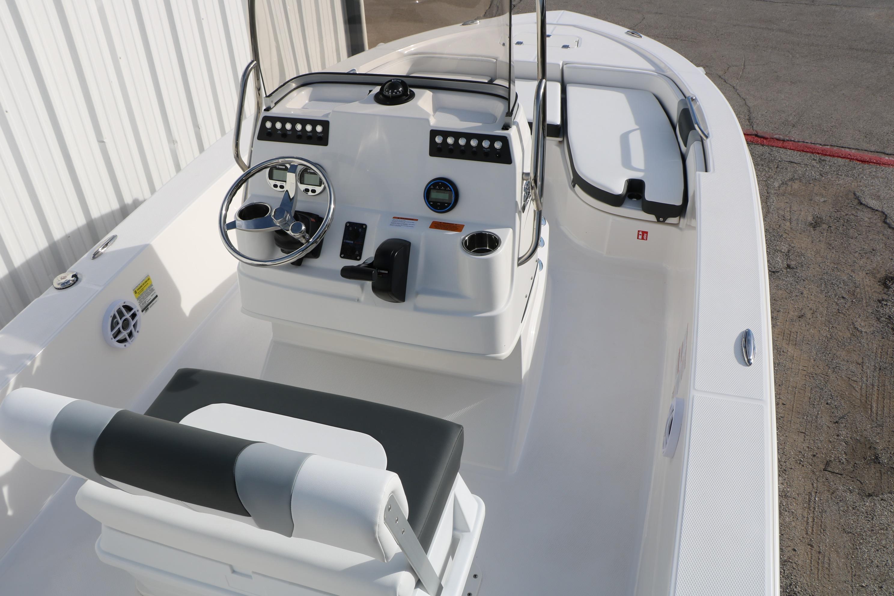 2026 Robalo 206 Cayman boat interior with steering console and seating.