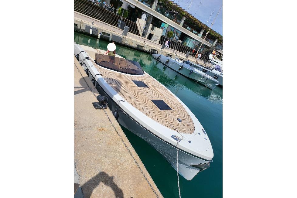 2019 Frauscher 1017 GT luxury boat docked at a marina.
