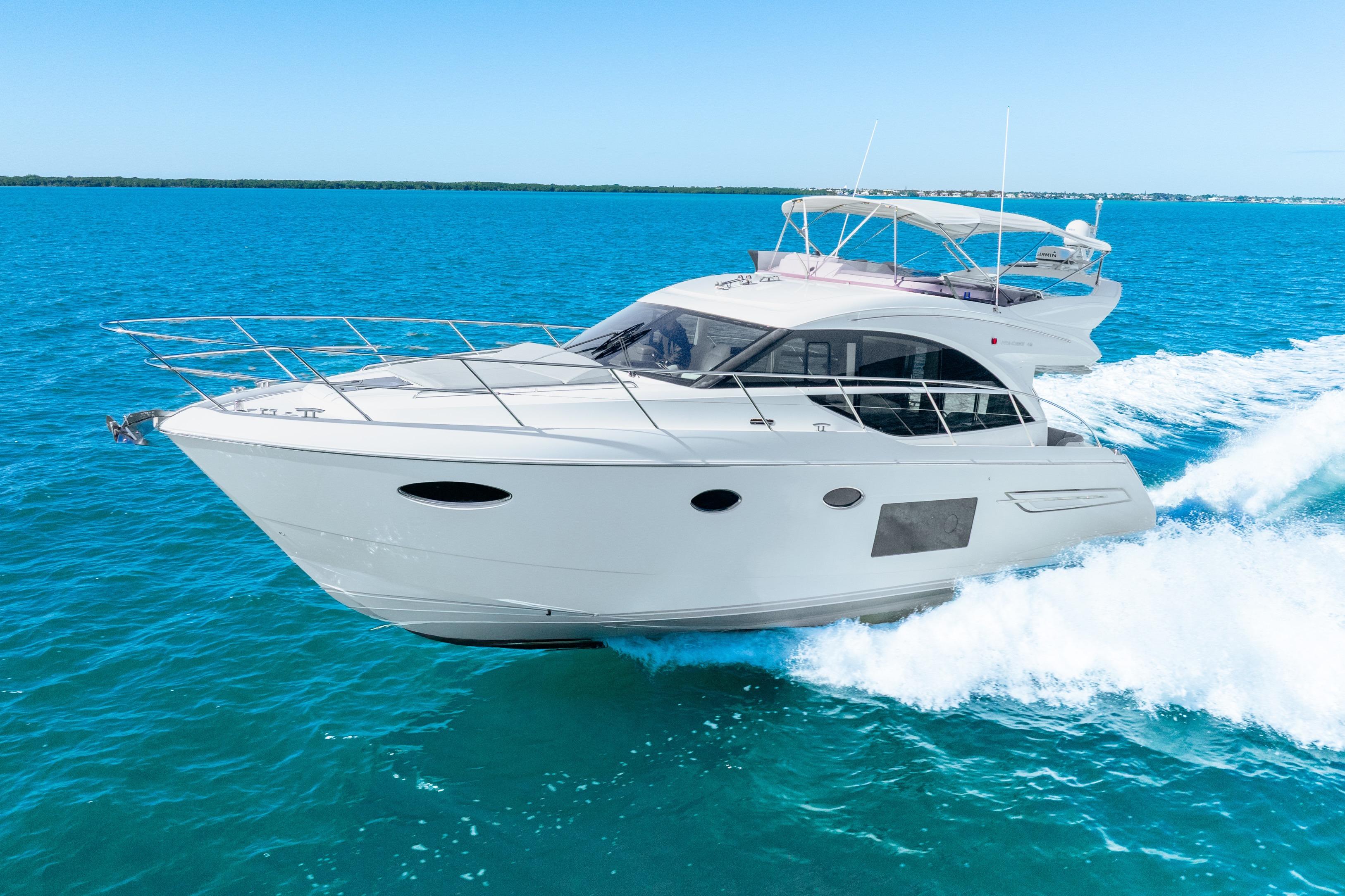 2018 Princess F49 yacht cruising on clear blue ocean waters.