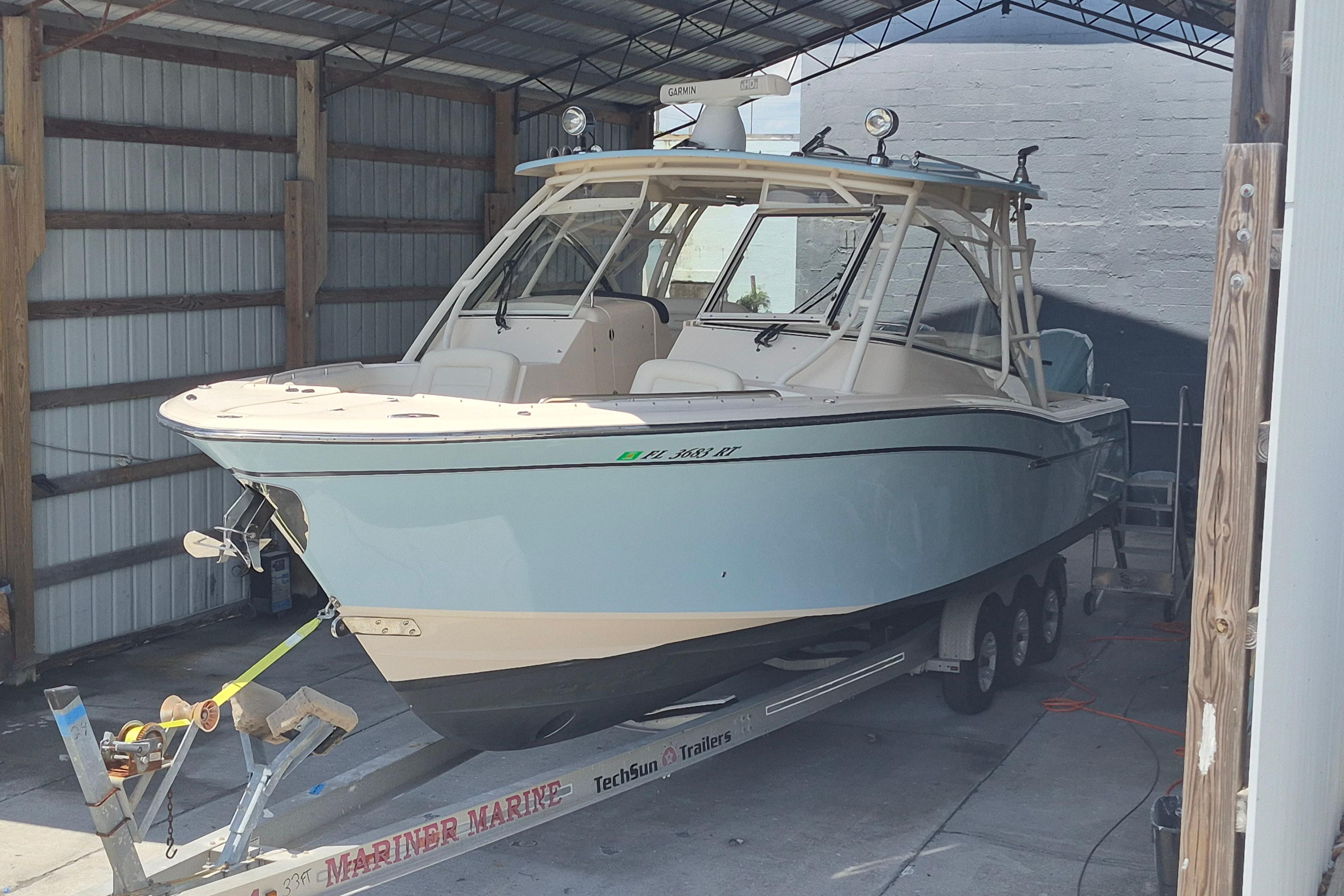 2019 Grady-White Freedom 335 boat on trailer in covered storage.
