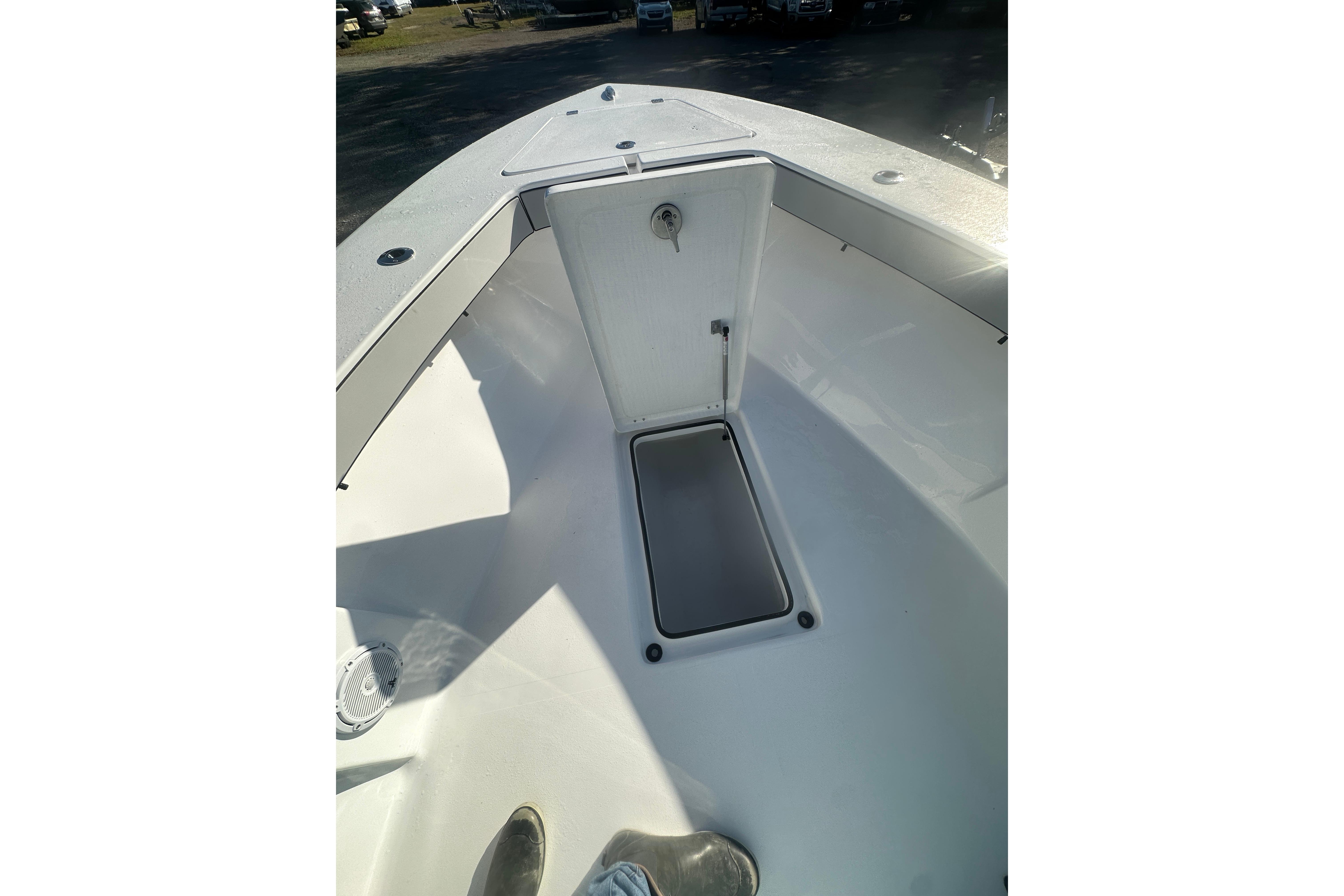 2026 Delta Boatworks Delta D245 bow with open storage compartment.