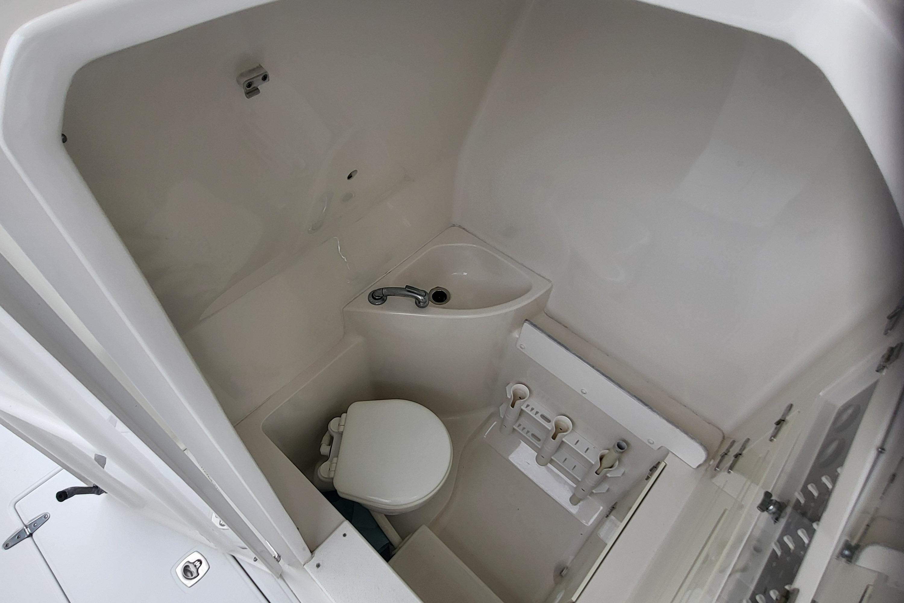 Interior of 2004 Jupiter 31 Center Console with toilet.