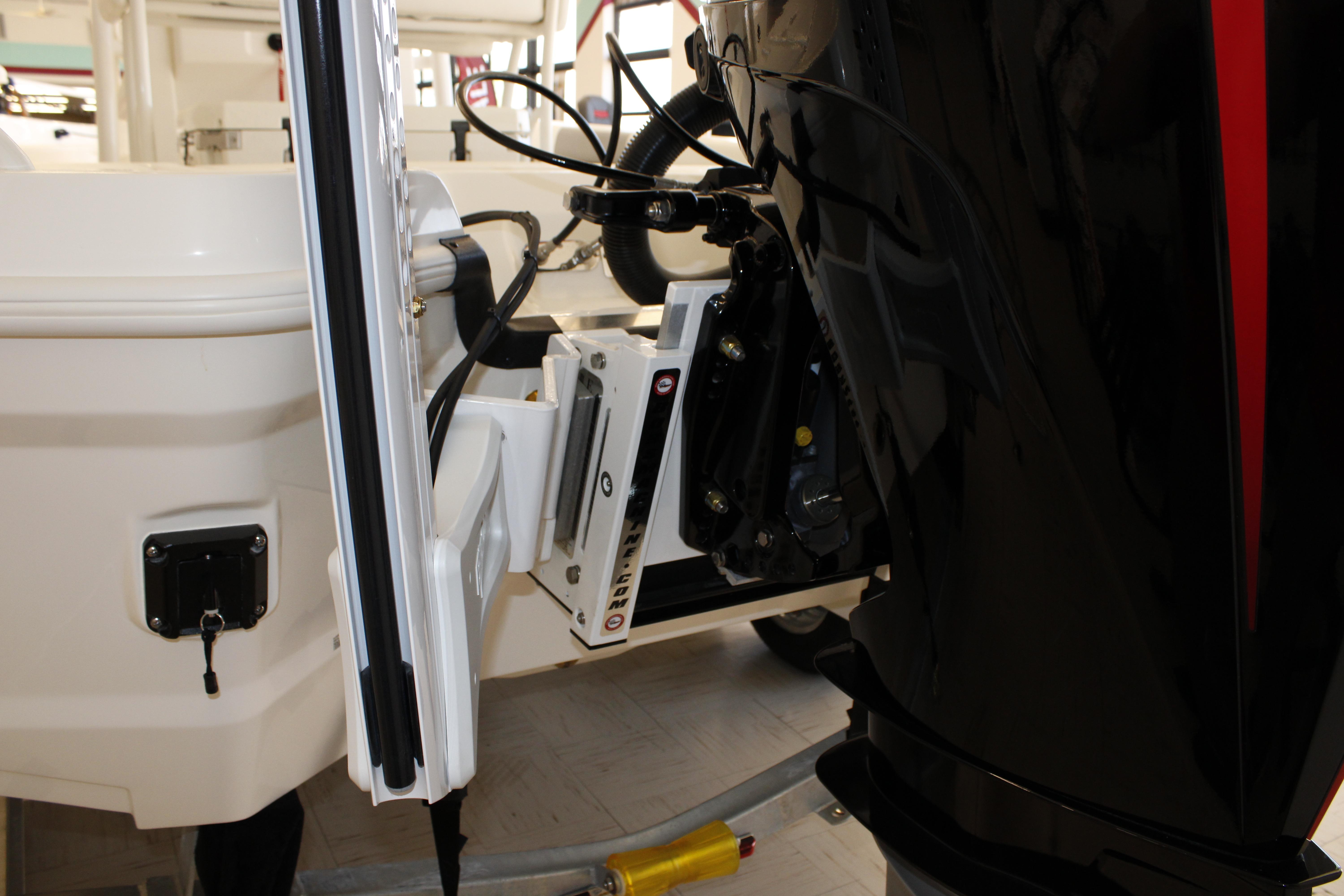 Close-up of a 2026 Mako 24 APEX boat engine and mounting bracket.