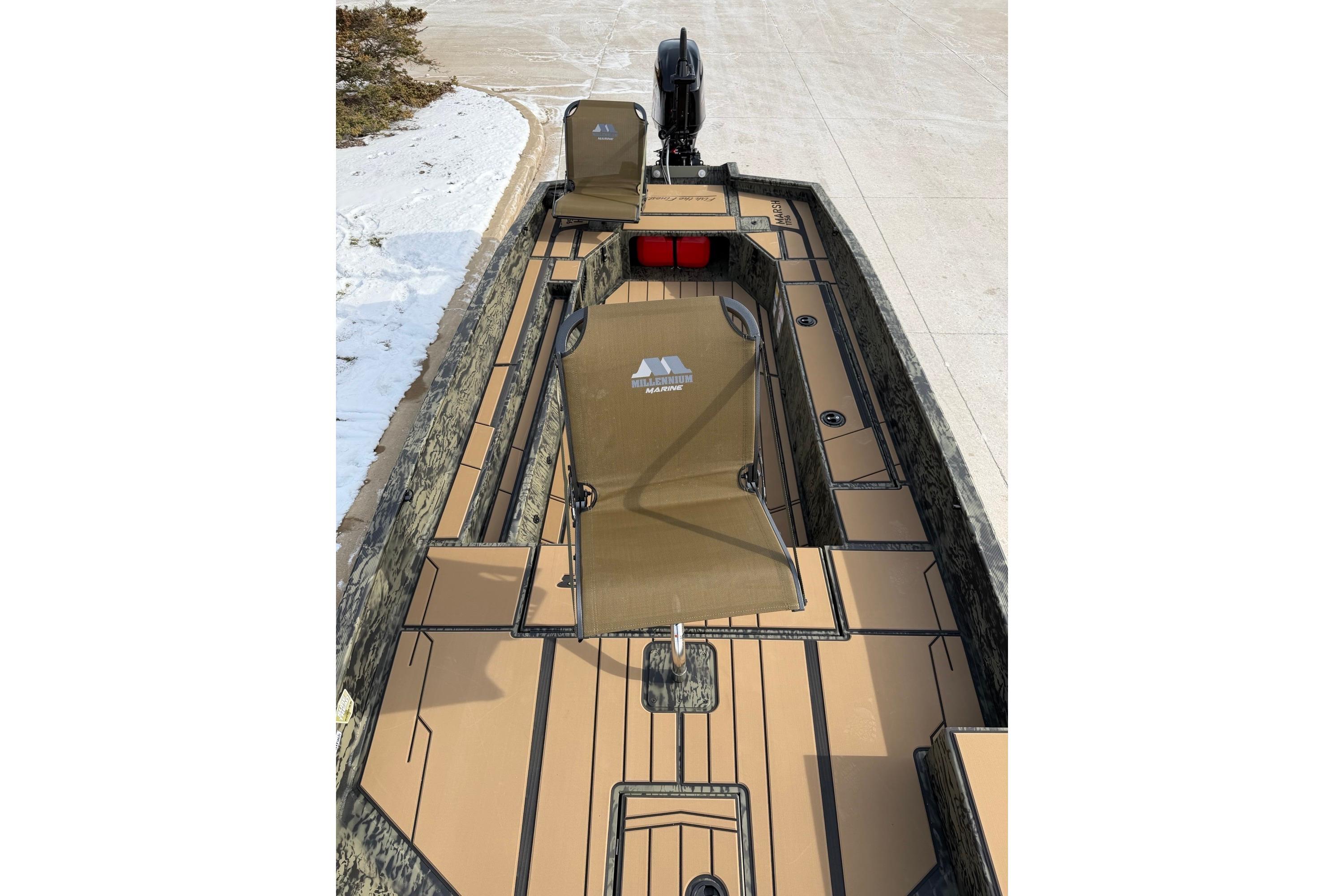 2026 Tracker Grizzly 1756 T Marsh boat with camouflage seating and spacious deck.