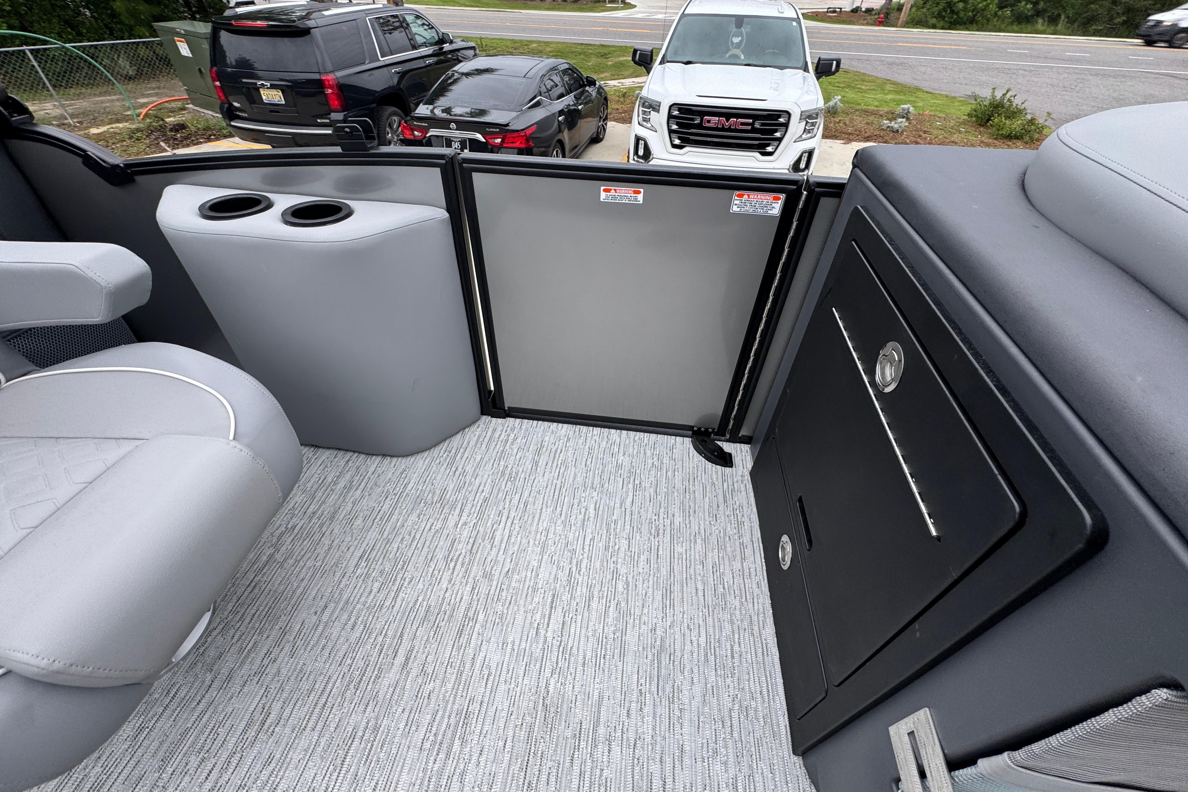 Interior of 2027 Bennington 24 MFB boat with seating and storage compartments.
