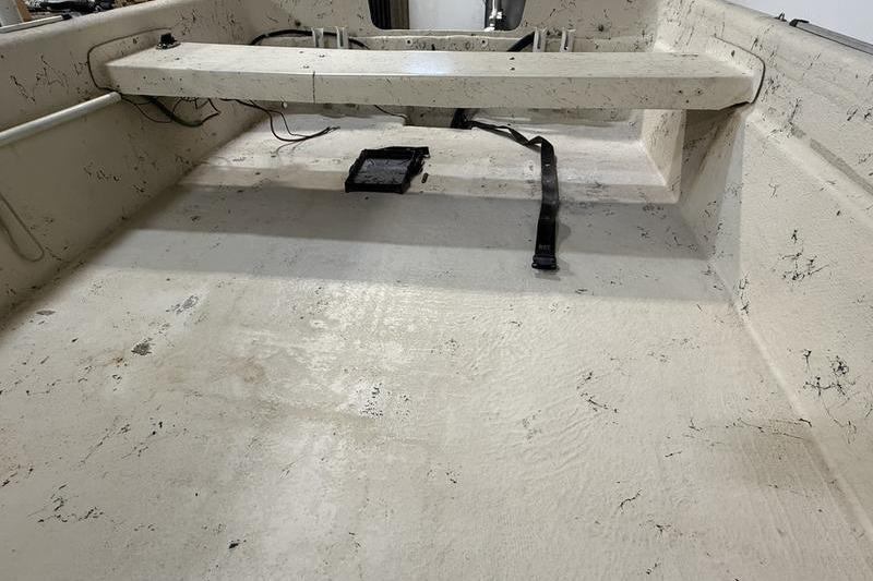 Interior of a 1998 Carolina Skiff 1965 V boat, showing seating and floor details.
