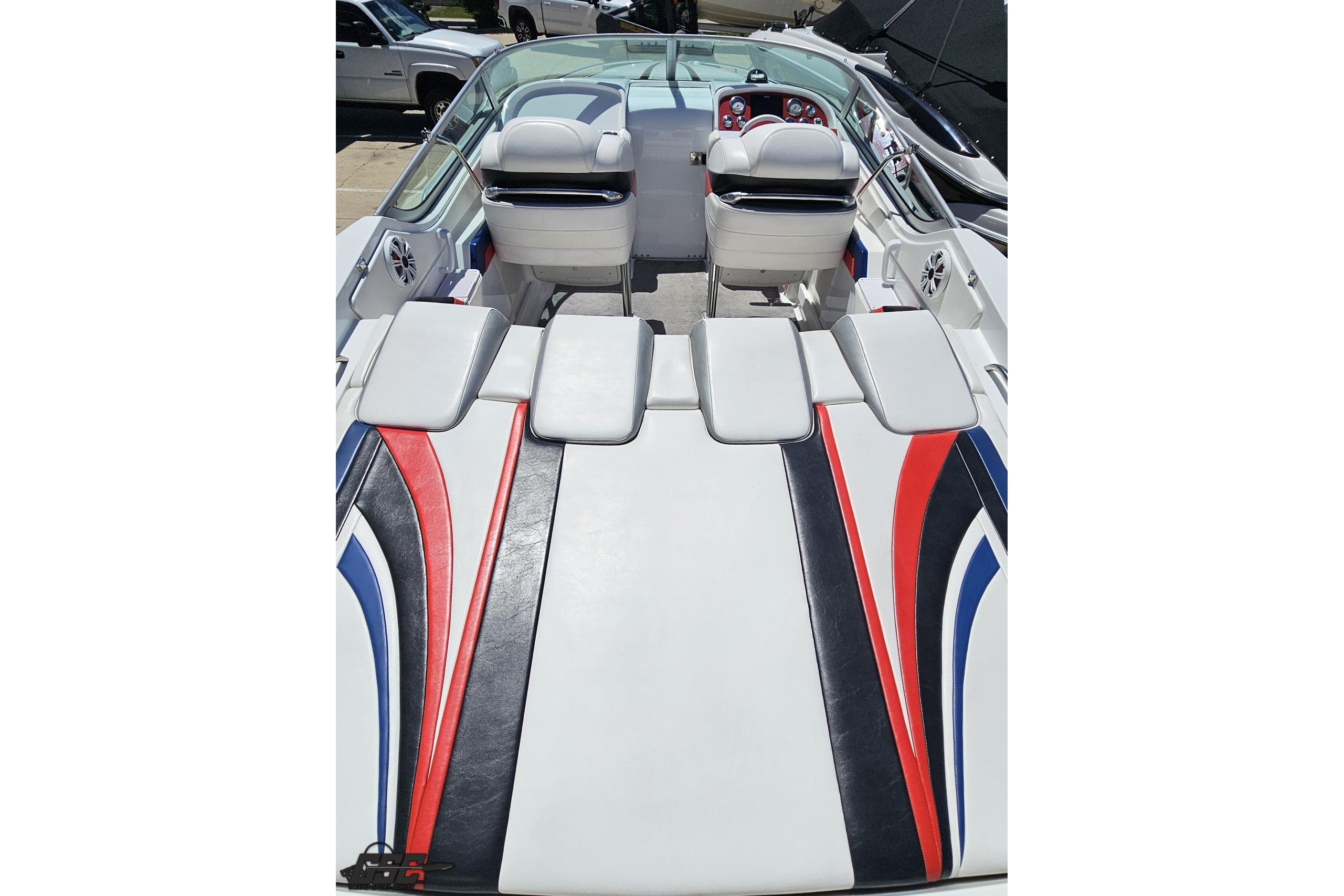2005 Formula 271 FASTech boat interior with sleek seating and vibrant red, blue, and black accents.