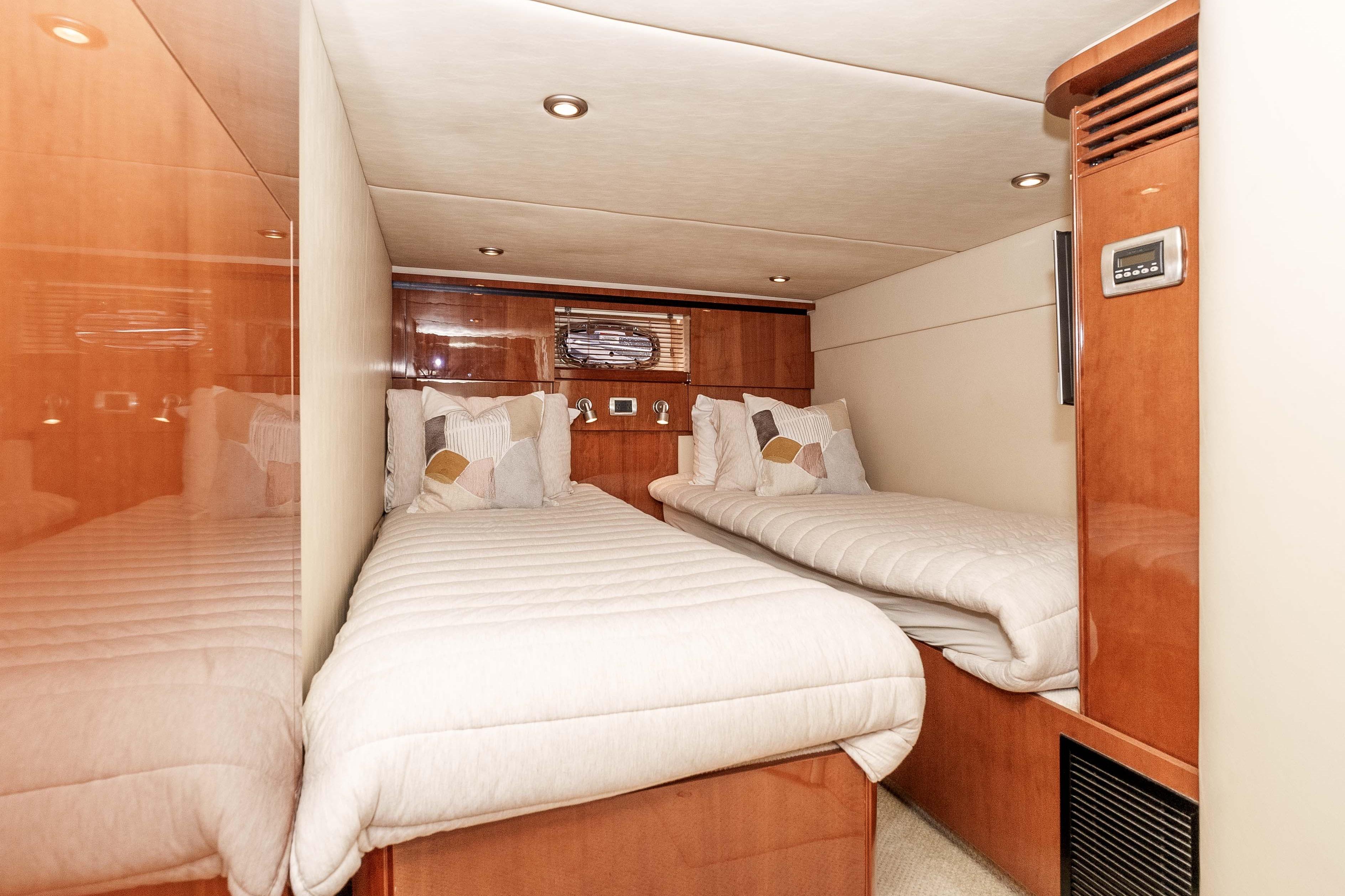 Luxurious twin cabin interior of 2007 Sea Ray 48 Sundancer yacht.