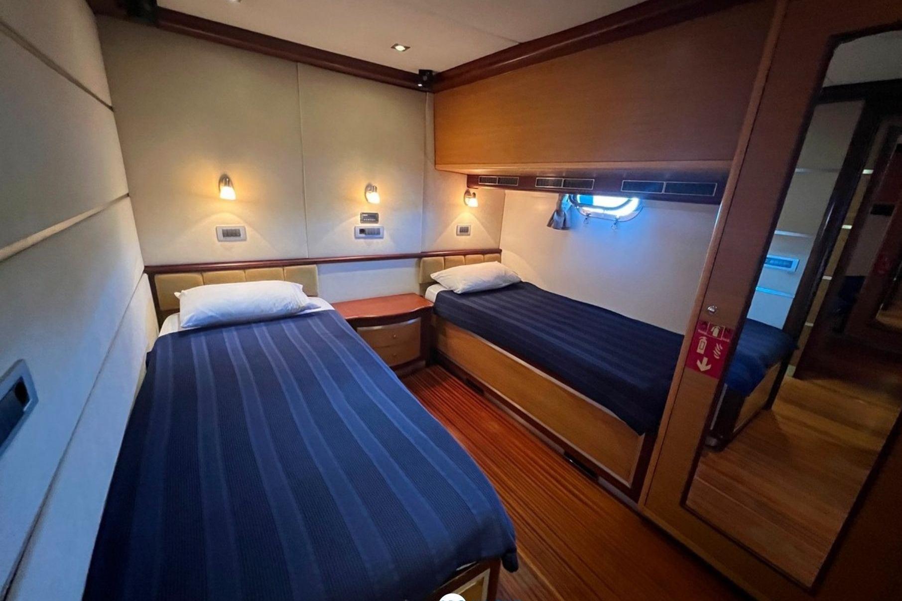 Twin cabin interior of 2014 Ark Yat 24M yacht with modern furnishings.