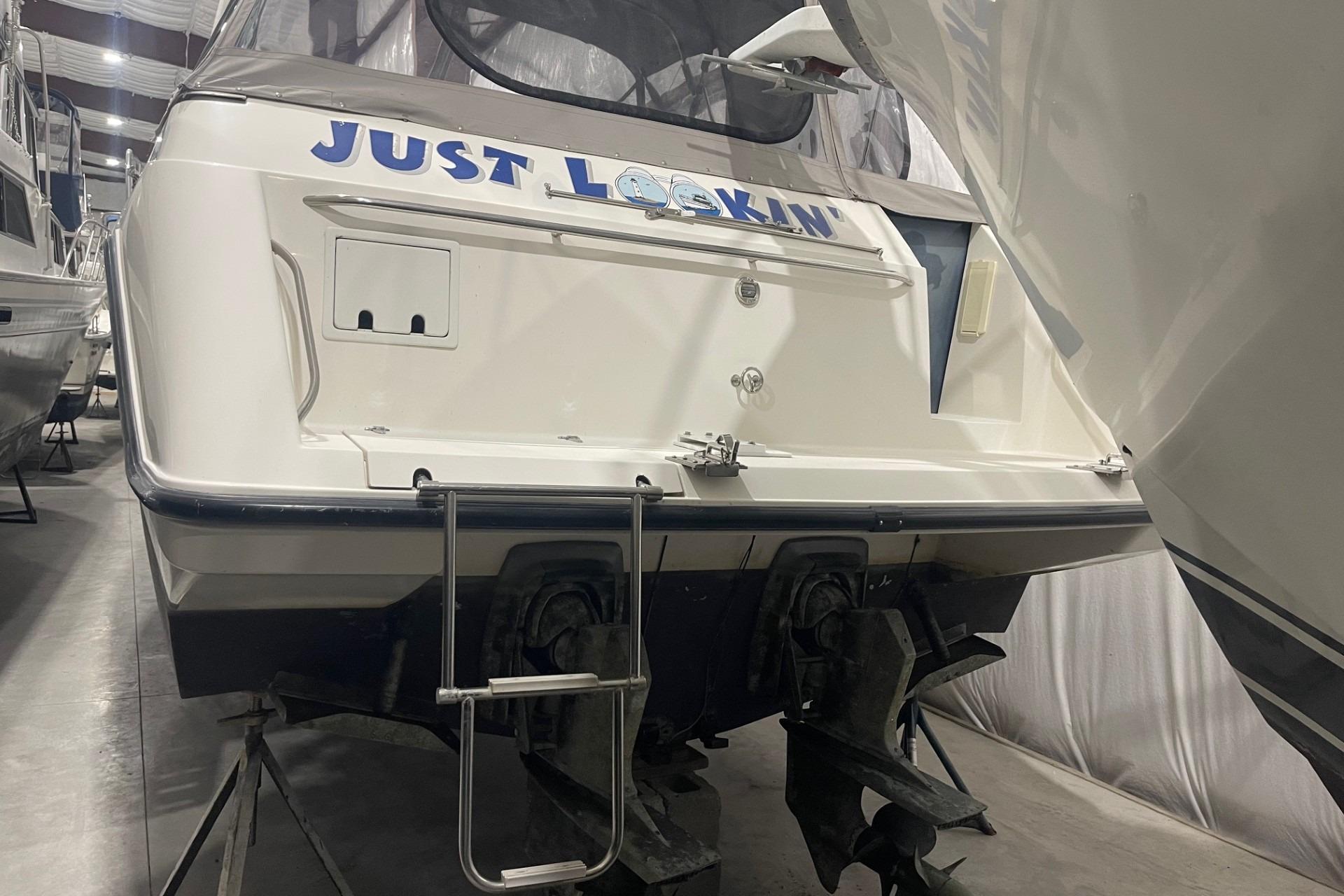 1992 Chaparral Signature 30 boat in storage, rear view with ladder.