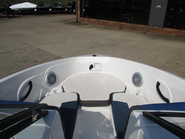 2023 Tahoe 185 S boat interior with seating and speakers, docked outdoors.