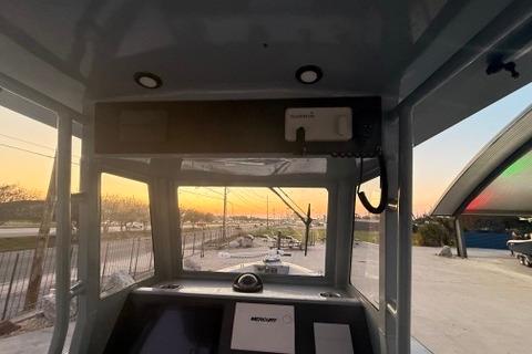 Interior view of a 2019 Metal Shark 28 CC boat at sunset.