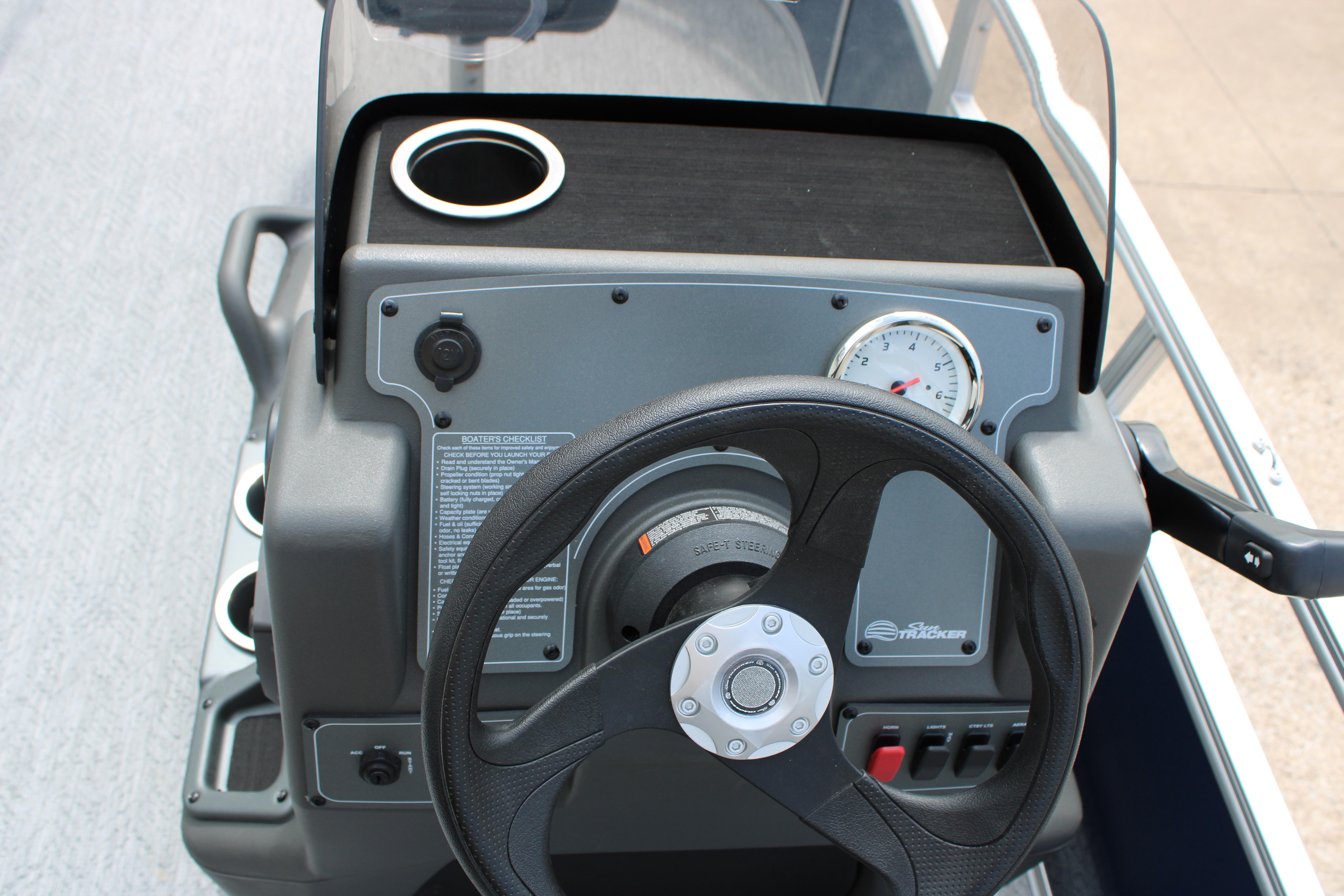 Steering console of 2026 Sun Tracker Bass Buggy 16 XL Select pontoon boat.