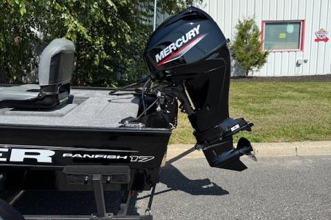 2026 Tracker Panfish 17 boat with Mercury outboard motor, parked outdoors.