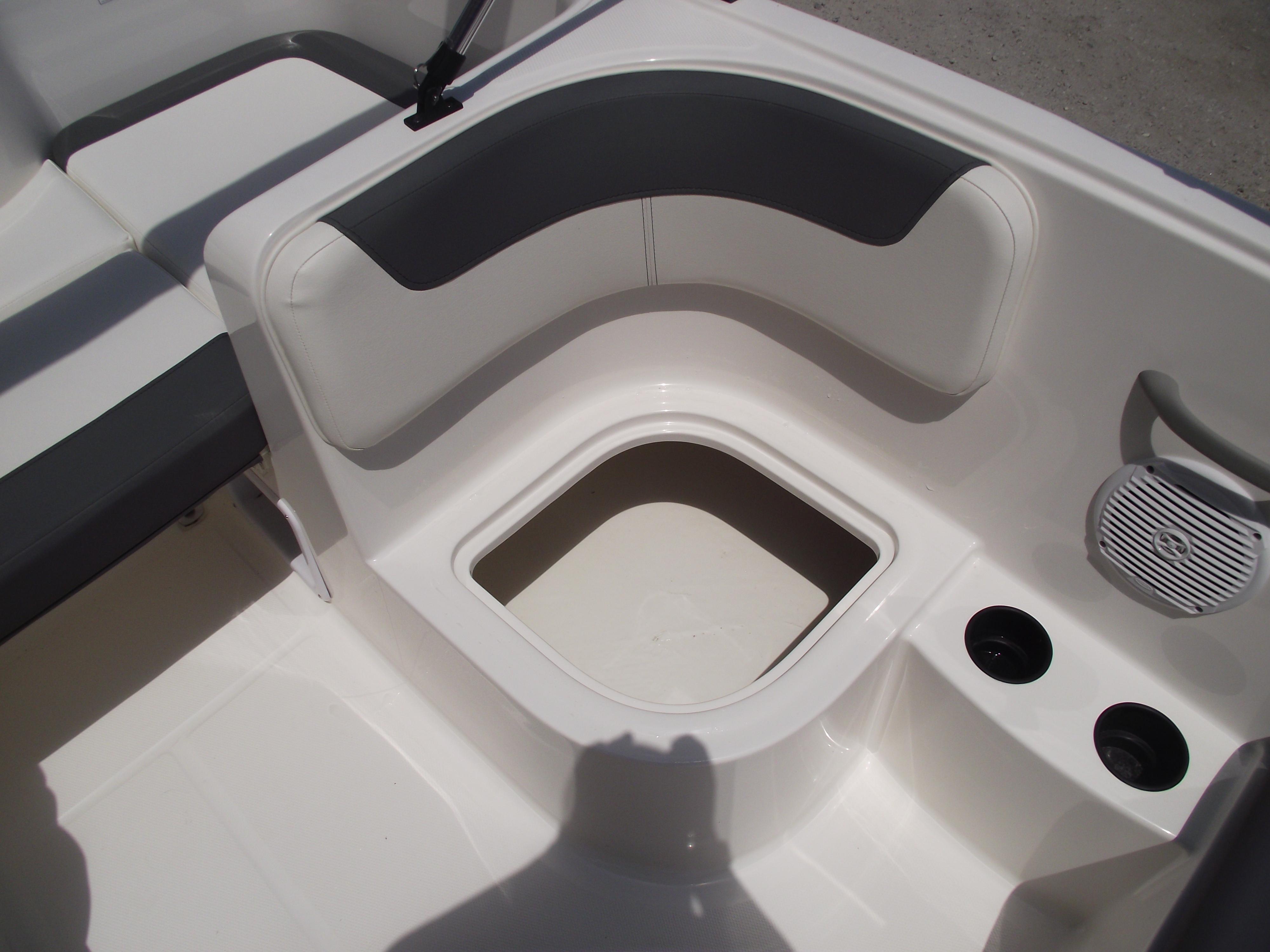 2025 Bayliner Element E16 boat interior with seating and storage compartment.