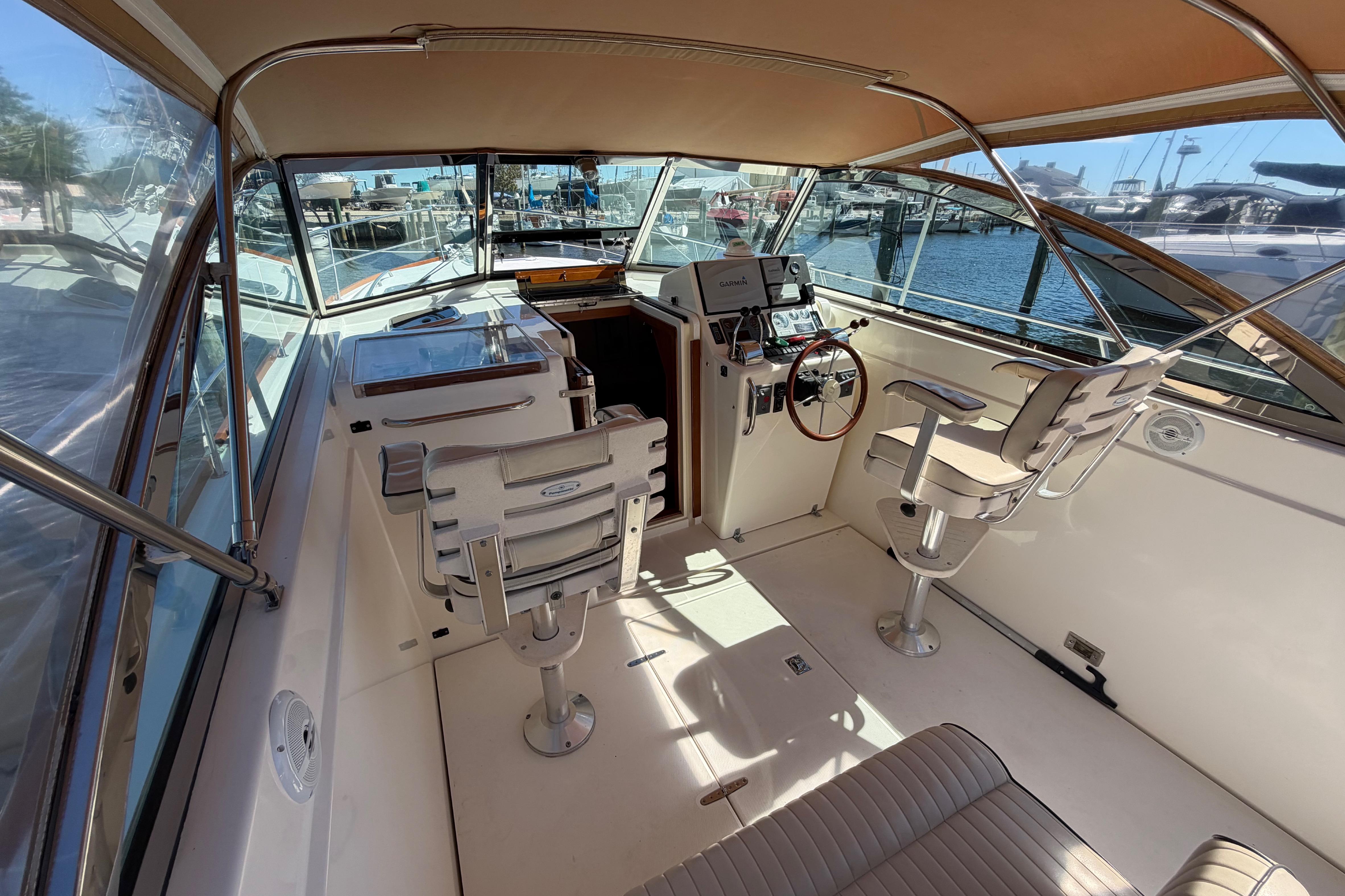 Interior view of a 2000 Sabreline 36 Express boat with helm and seating.