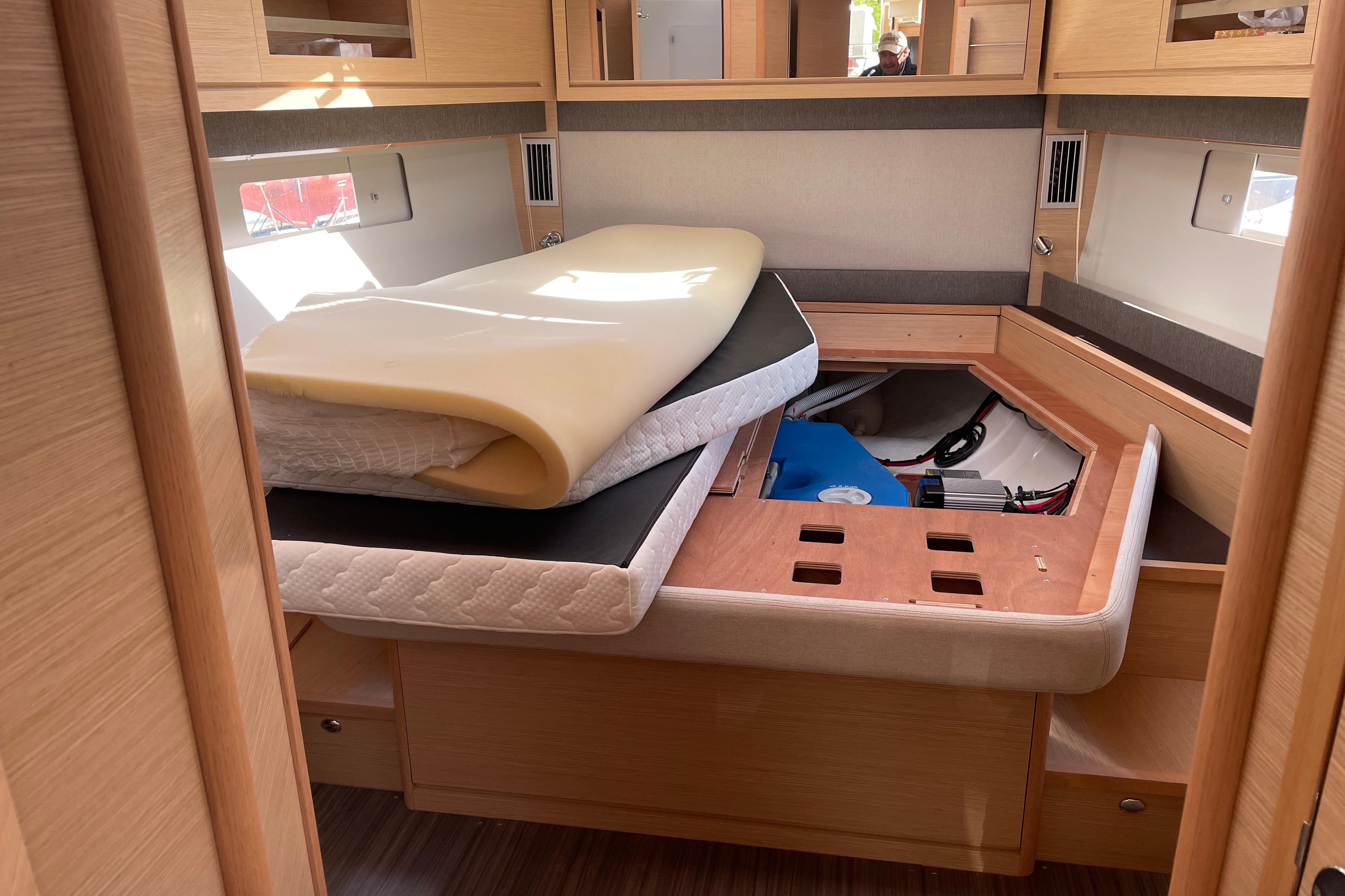 Interior cabin of 2022 Dufour 530 yacht with storage under bed.