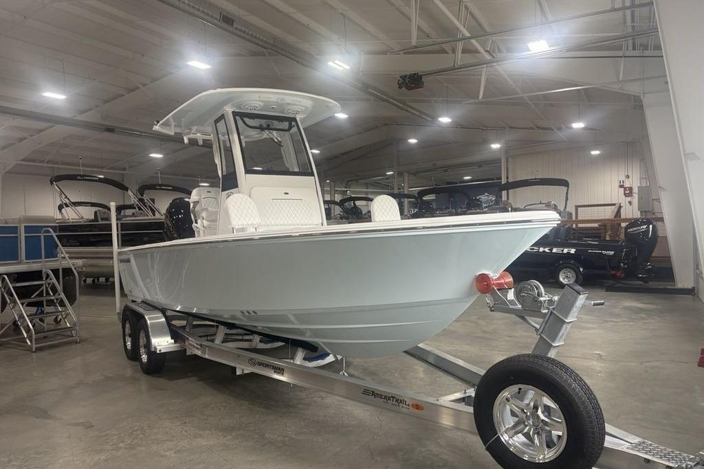 2026 Sportsman Masters 227 boat on trailer in indoor showroom.