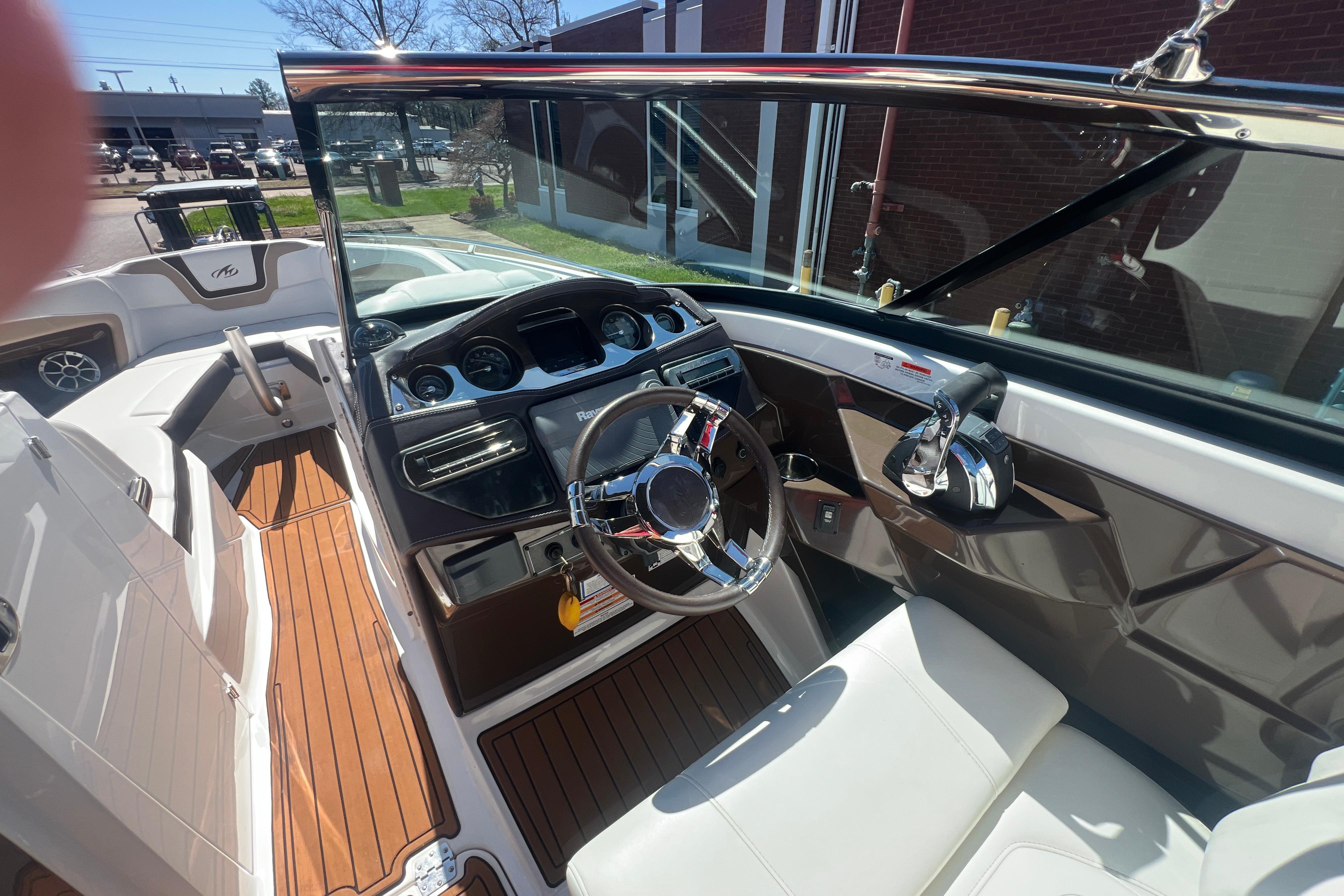 Interior view of a 2017 Monterey 298SS Super Sport boat cockpit with steering wheel.