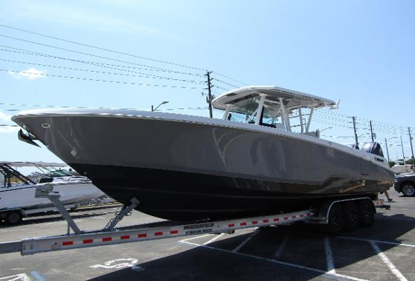 2024 Wellcraft 352 Fisherman boat on a trailer in a parking lot.