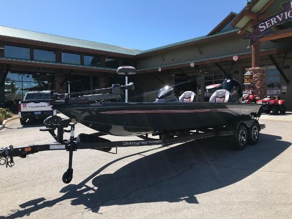 2025 Ranger ALPHA 208 boat on trailer outside a service center.
