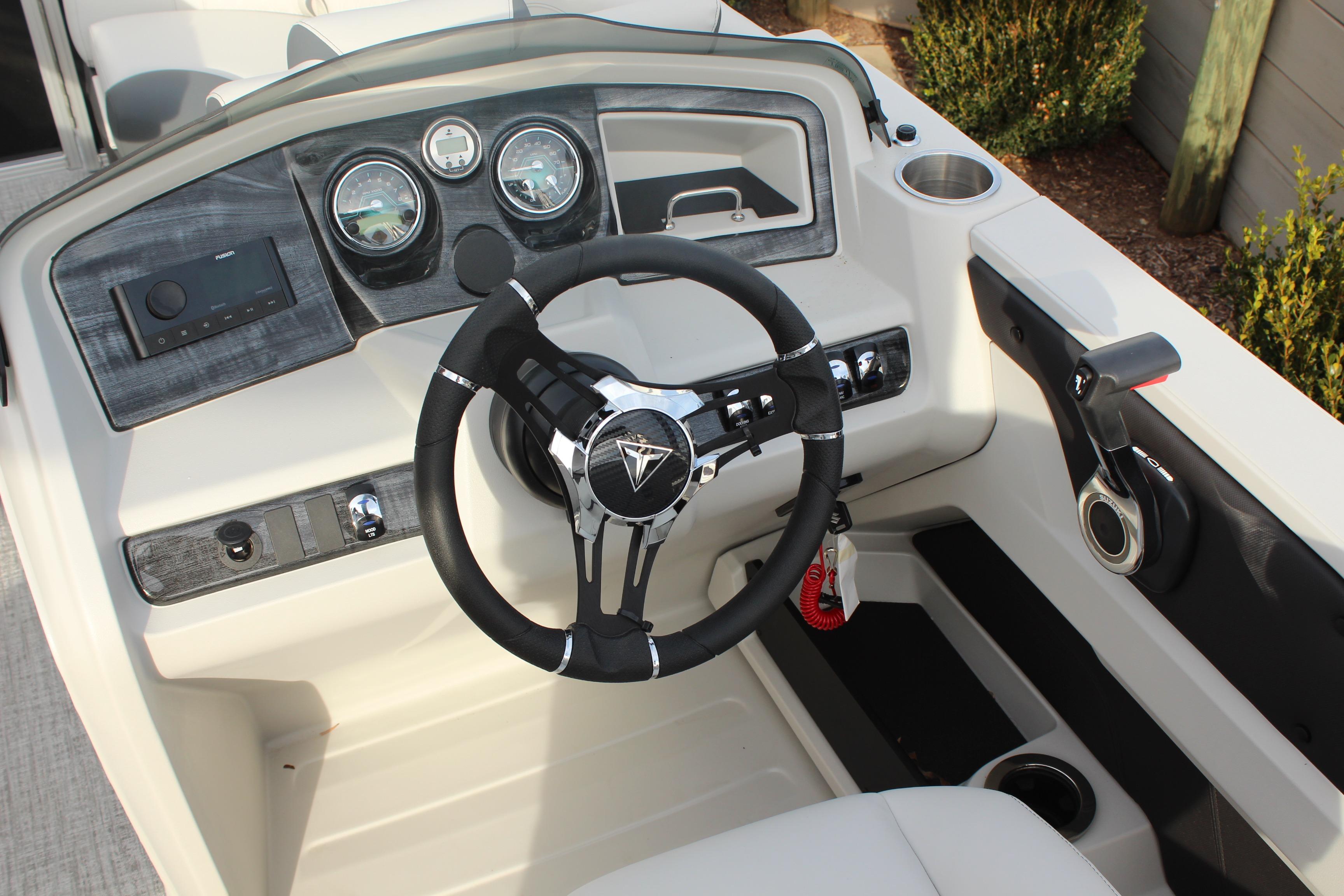 2026 Tahoe Pontoon LTZ dashboard with steering wheel and control panel.
