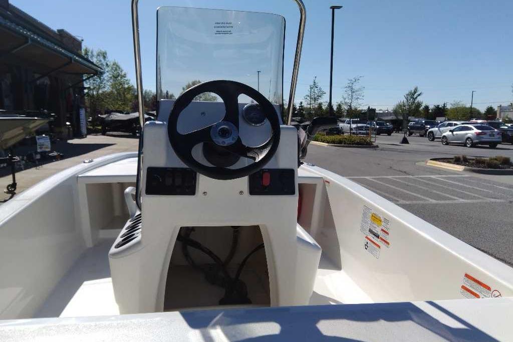 2026 Mako Pro Skiff 13 CC boat in parking lot, steering console view.