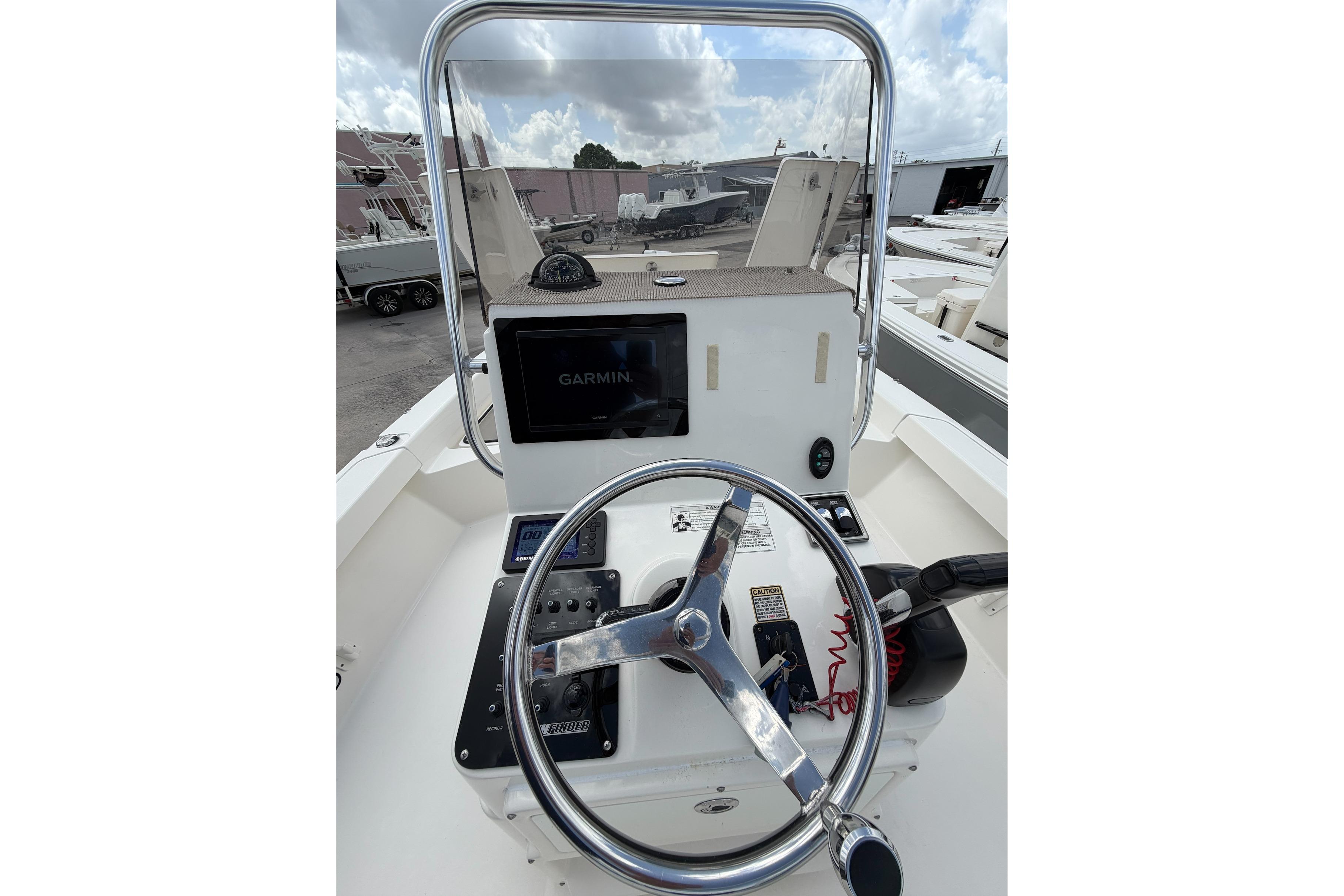2017 Pathfinder 2200 TRS boat console with Garmin navigation system and steering wheel.