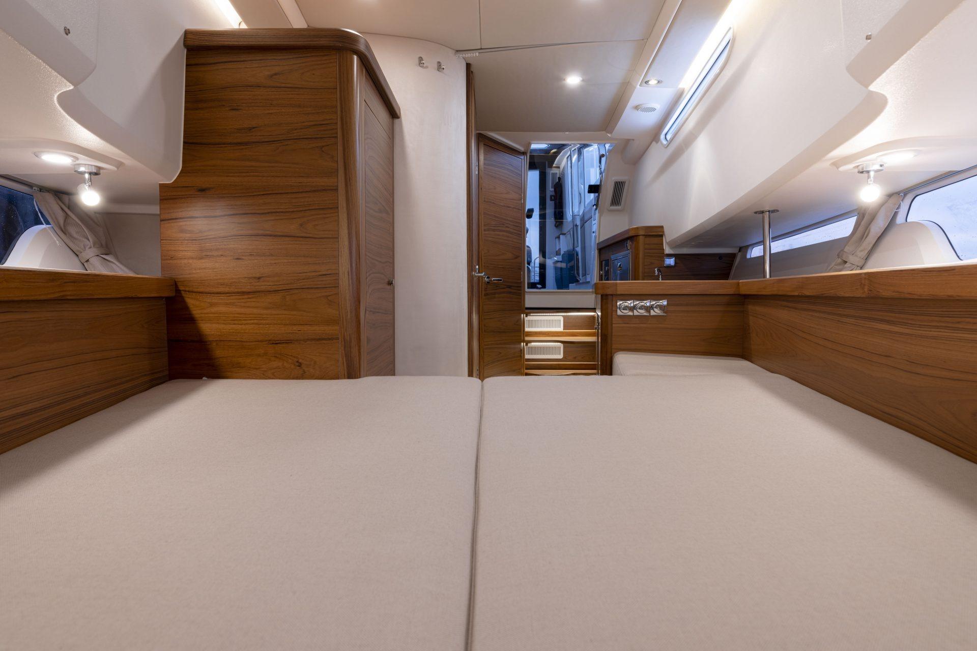 Interior of Nimbus Commuter 11 yacht, 2025 model, featuring wood paneling.