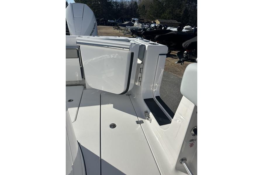 2026 Sportsman Open 282 Center Console boat deck with storage compartment.