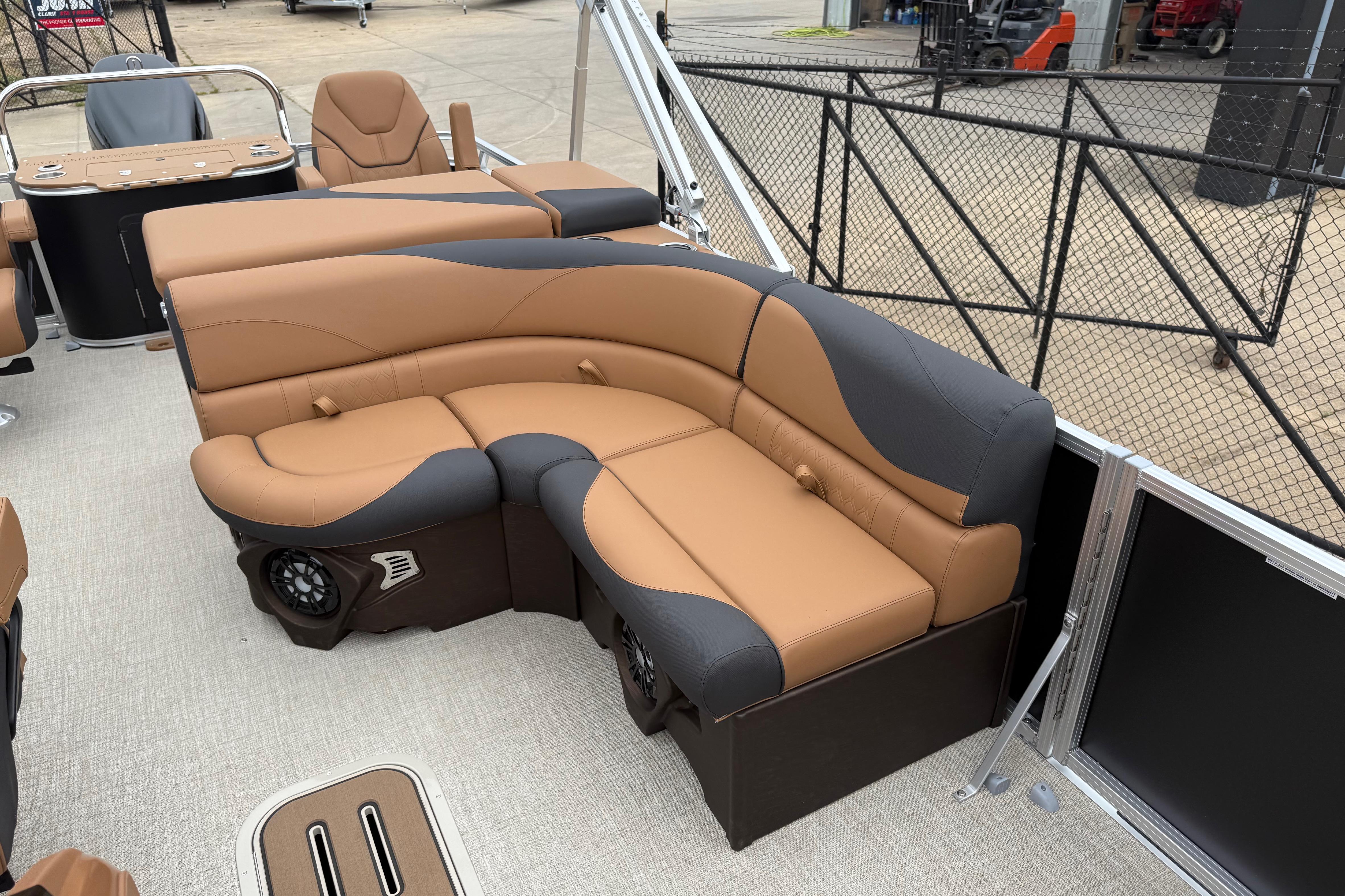 Luxurious seating on 2026 Avalon LSZ Rear Fish pontoon boat, featuring tan and black upholstery.