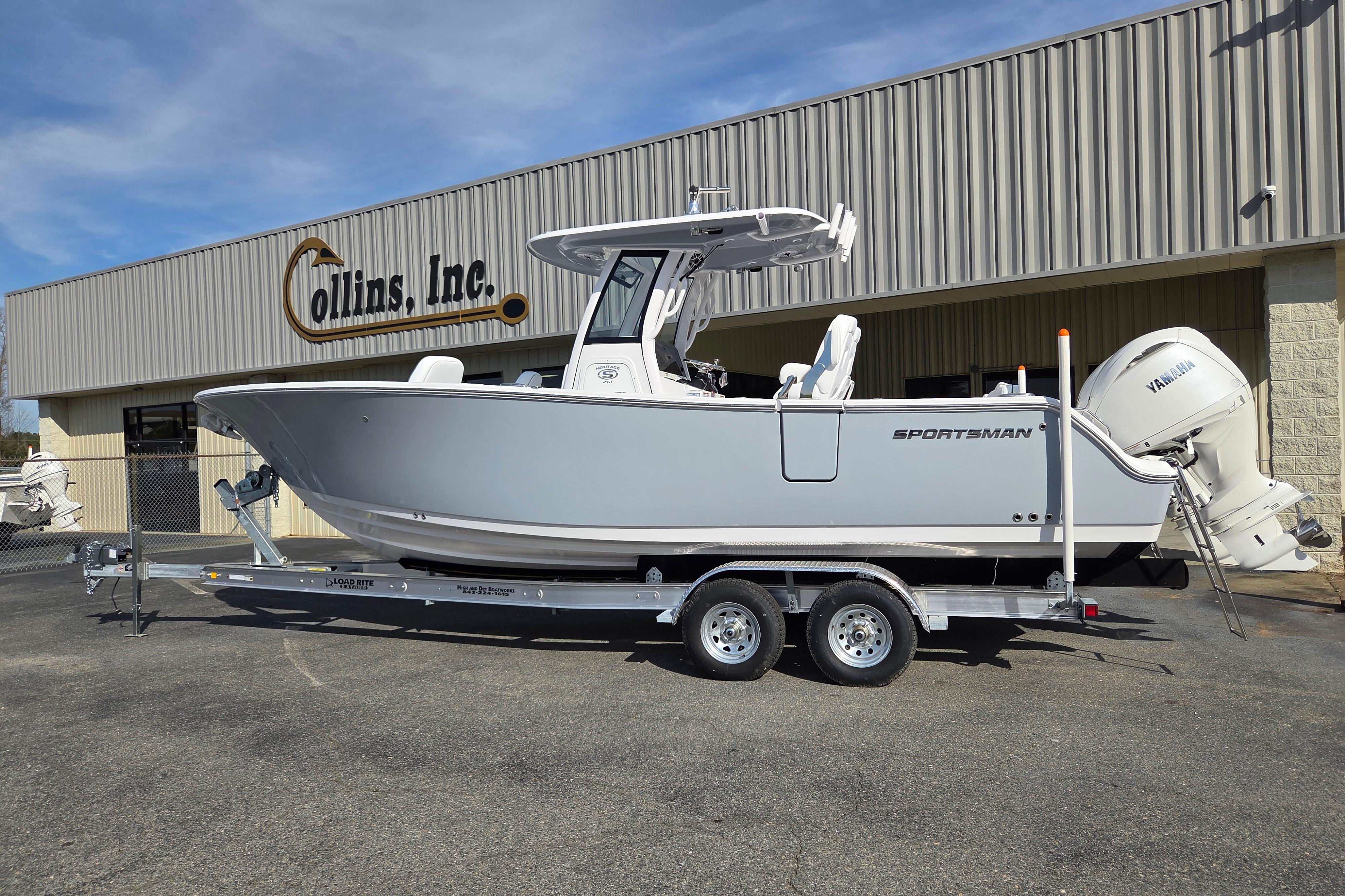 2026 Sportsman Heritage 261 Center Console boat on trailer outside dealership.