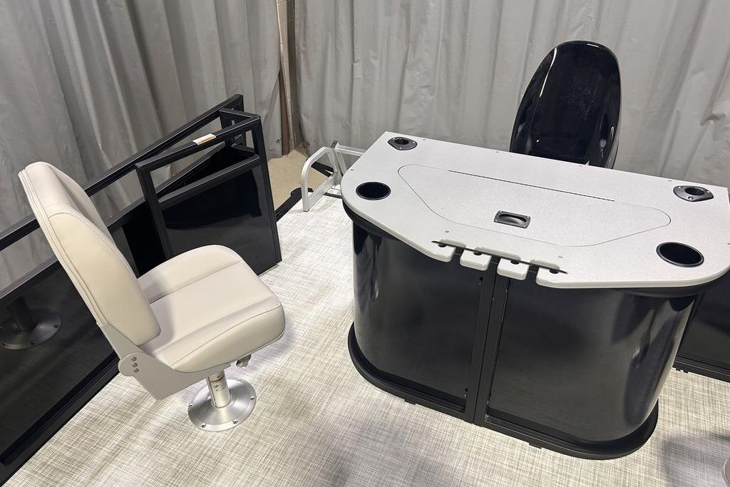 2026 Dockside 22DF boat interior with swivel chair and control console.
