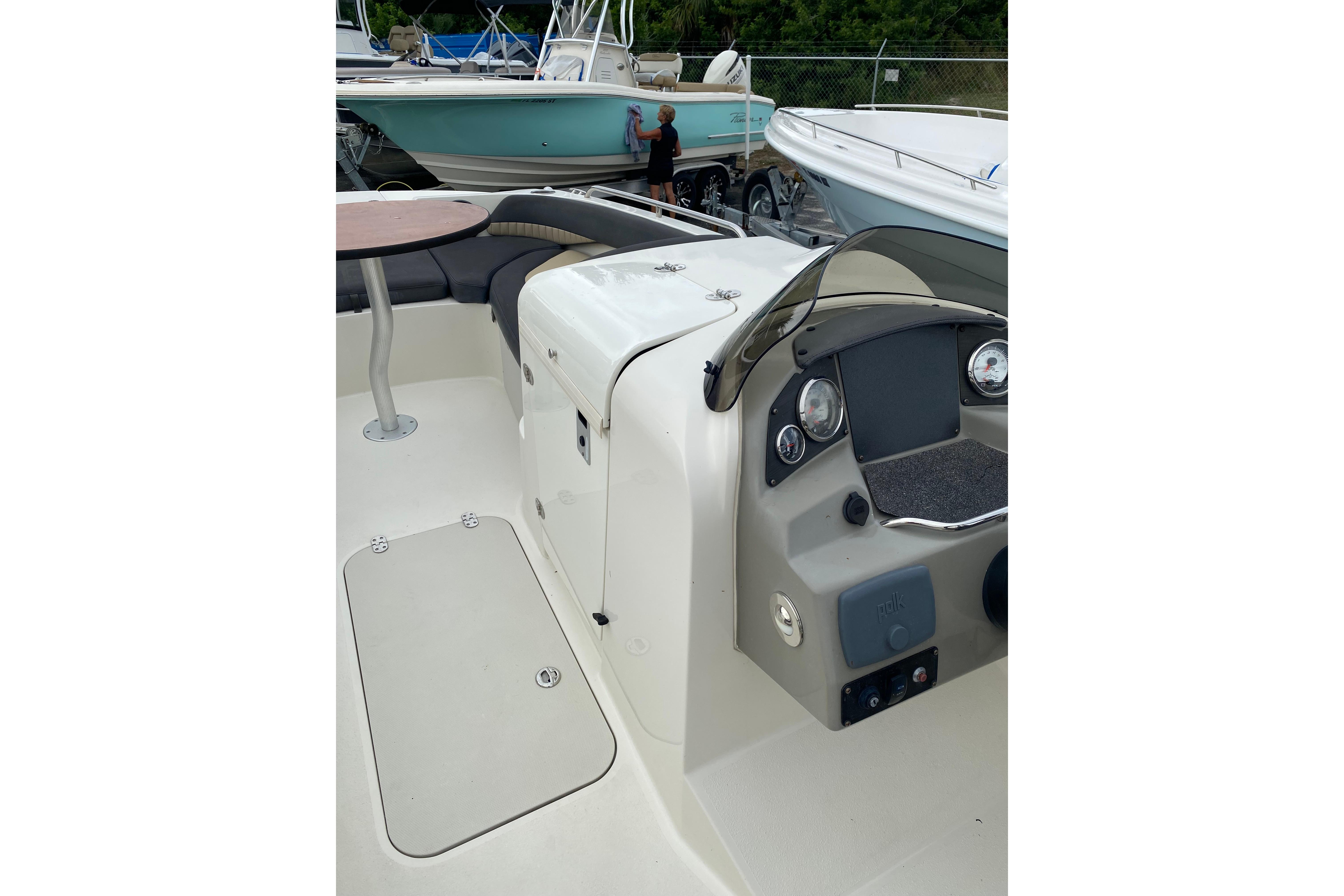 2018 Stingray 212 SC boat interior with dashboard and seating area.