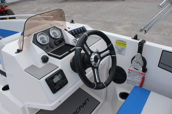 2025 Starcraft SV 16 OB boat dashboard with steering wheel and control panel.