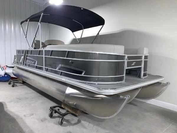 2024 Starcraft EX22 FD pontoon boat in a showroom.