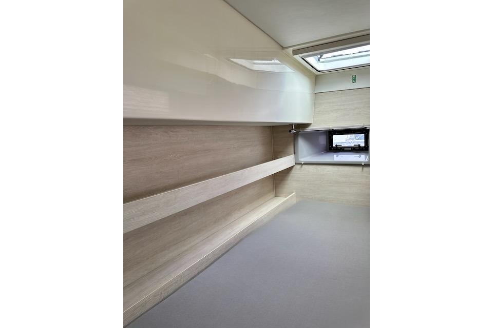 Interior of 2017 Leopard 40 yacht, featuring sleek wood paneling and modern design.