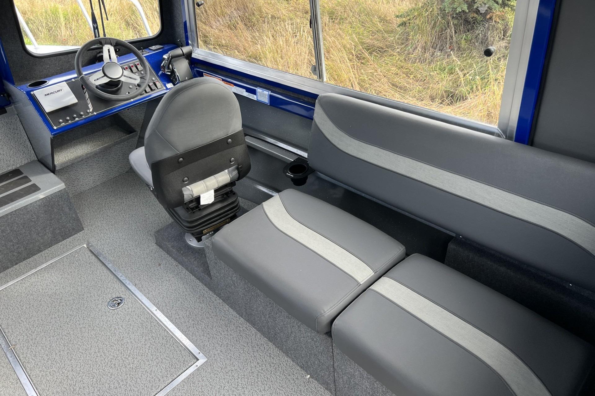 2024 Spartan 26 Maximus Pro XL boat interior with steering console and seating.